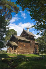 Old wooden church on a sunny day.