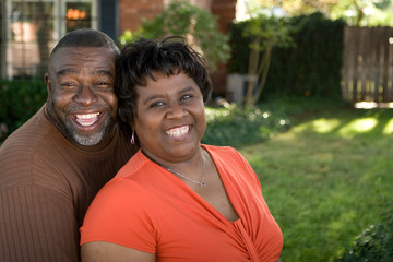 Obraz premium Mature African American couple laughing and hugging.