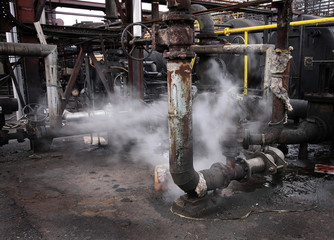Industrial pumping units with steam escape and environmental issues.
