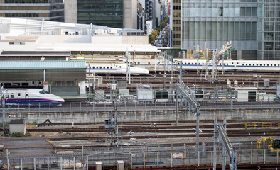 Japan trains and railway with electricity poles in Tokyo.