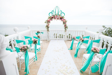 Wedding arches in the Tiffany color. Sea. The ocean.