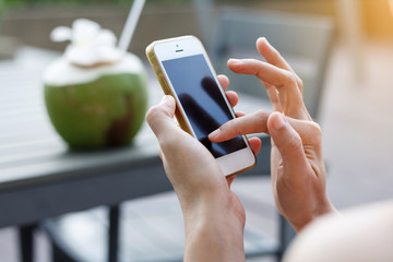  Women play smartphones at the vacation