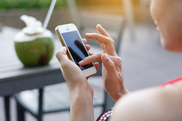  Women play smartphones at the vacation