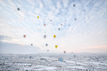 Group of Hot Air Balloons Flying Over Cappadocia During Sunrise