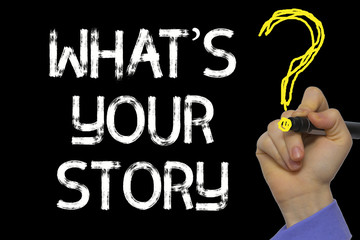 Hand writing the text: What’s Your Story