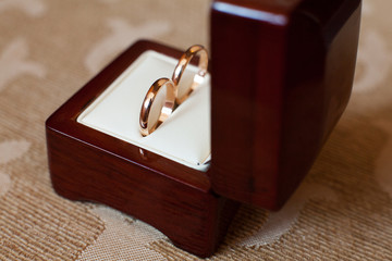 Engagement rings in wooden box.