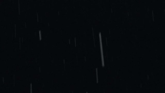Heavy wet snow falling in winter plate.(4K). Shot for compositing over footage. Use  with blending mode (add or screen) to remove the black background or use as matte. Shutter 1/50 for motion blur. 