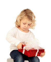 Small blond child with a red present