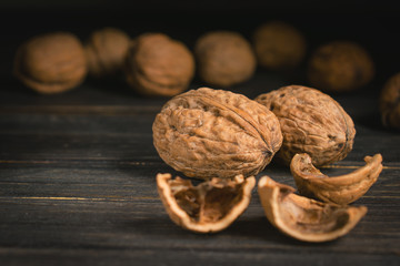 walnuts on black wood background