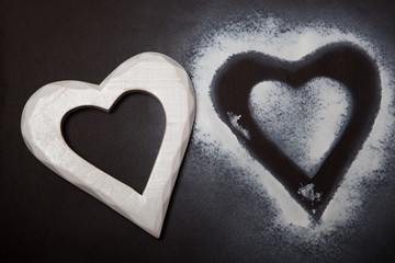 Holidays gift and heart on a black background. Valentines day