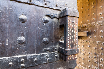Wooden old latch of the wooden ancient gate of the caravansary (Wikala) of Bazaraa, Cairo, Egypt