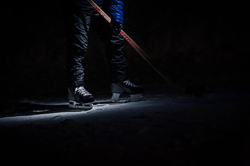 Fototapeta na wymiar Hockey Stick and Puck on the Ice Rink
