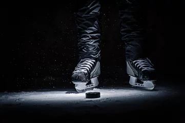 Fototapeten Hockey Stick and Puck on the Ice Rink © Vasilev Evgenii