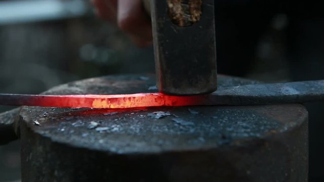 glowing iron ready for blacksmith with hammer