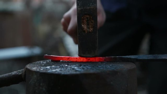 glowing iron ready for blacksmith with hammer