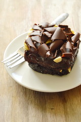 chocolate butter cake topping slicing chocolate and fork on dish