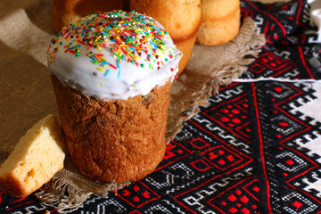 Happy Easter cupcakes on traditional tablecloth.