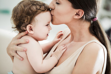 Mother Kissing Her Baby