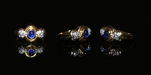 Jewellery diamond ring and gemstone on a black background