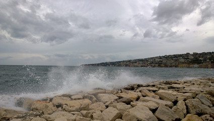 Overlooking the Gulf of Naples in windy weather, the promenade of Naples. Splashing waves