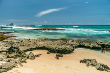 Sunny beach near Koggala - Sri Lanka. Waves of clear water and warm sand 