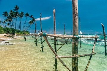 Sunny beach near Koggala - Sri Lanka. Waves of clear water and warm sand 