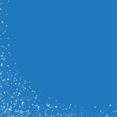 Beautiful snowfall. Abstract left bottom corner on blue background. Vector illustration.