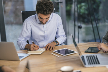 Young team of coworkers making great work discussion in modern c