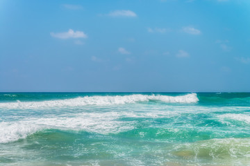 Sunny beach near Koggala - Sri Lanka. Waves of clear water and warm sand 