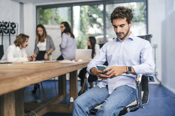 Young team of coworkers doing a meeting in a modern studio