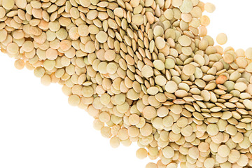 Border of green lentil closeup with copy space on white background. Isolated. Healthy protein food.