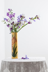 iris in vase on white background