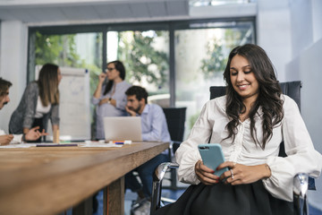 Young team of coworkers doing a meeting in a modern studio