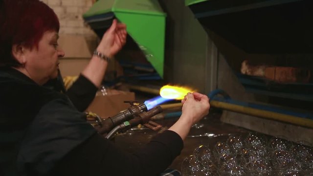 Glass blowing process. production of glass toys