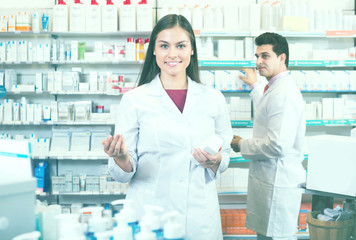 pharmacists  posing in drugstore