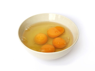 fresh eggs in a bowl on a white background