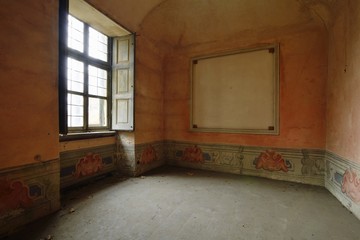 old abandoned orange room with window