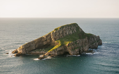 View of Deva island in a sunny day, in the coast of Bayas, Asturias, on Spain. It is the biggest island in all asturian coast. © David Pereiras