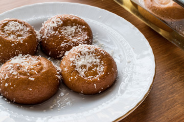 Turkish Dessert Sekerpare with coconut powder / Small cakes with sherbet