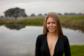 Attractive girl with black shirt in the field