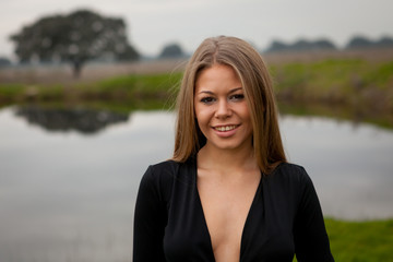 Attractive girl with black shirt in the field