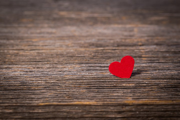 Fototapeta premium Red heart on old wooden background