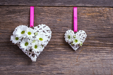 Wicker heart on the board background