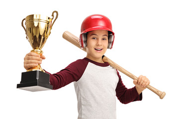 Cheerful boy holding golden trophy and baseball bat
