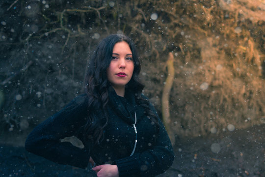 Young girl in a dark forest