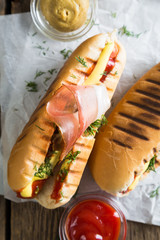 Hot dogs on a wooden table