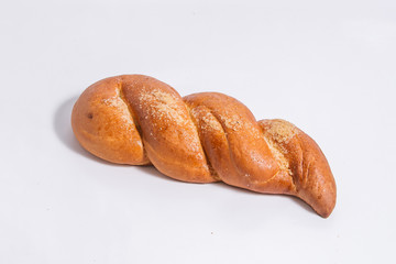 The loaf is made as a braid on a white background.
