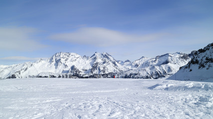 Tops of Alp mountains covered with snow, on a skiing slope near Courchevel winter resort, 3 Valleys, Alps, France