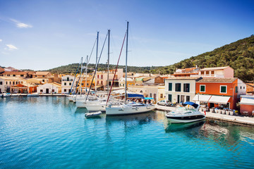 Fototapeta na wymiar Sailing boats in the Gaios town, Paxos island, Greece