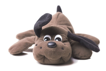 soft brown toy dog lying
